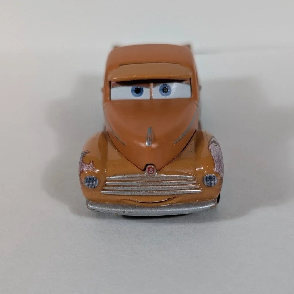 Disney Pixar Cars Smokey Diecast Truck Mattel DXV37 Orange Piston Cup Racing